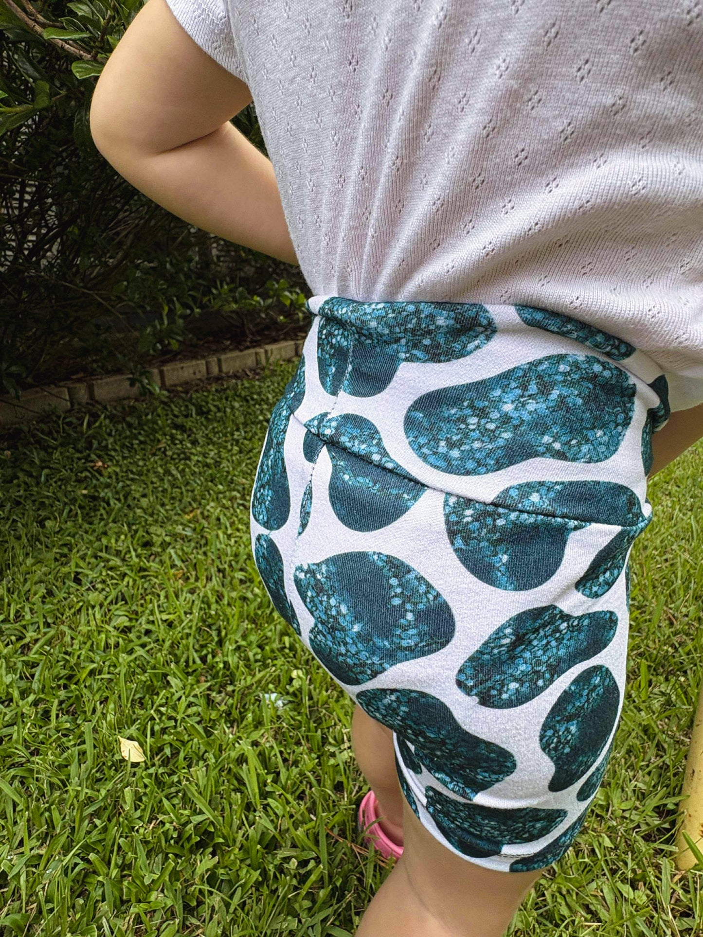 Teal cow bikers